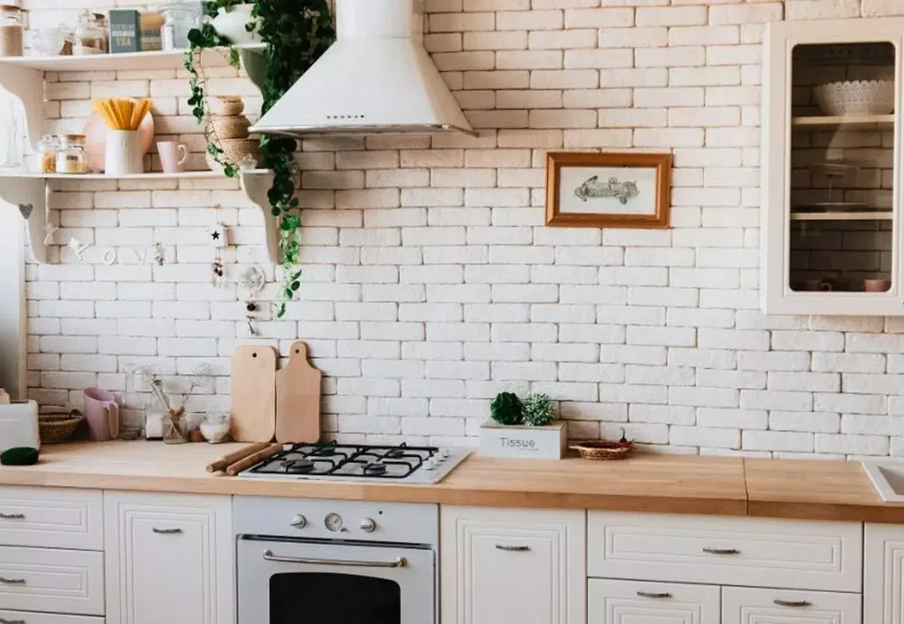 A tidy, organised cream kitchen