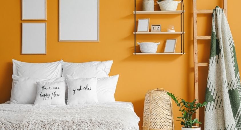 a yellow bedroom with a comfy bed with white bedding and pillows with the words this is our happy place and good vibes on