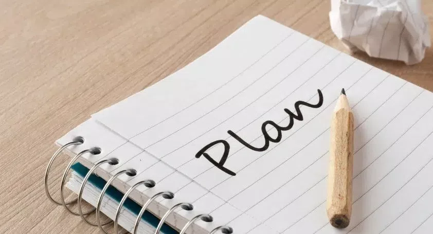 Notebook with the word plan on