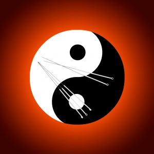 Oriental yin-yang symbol with acupuncture needles