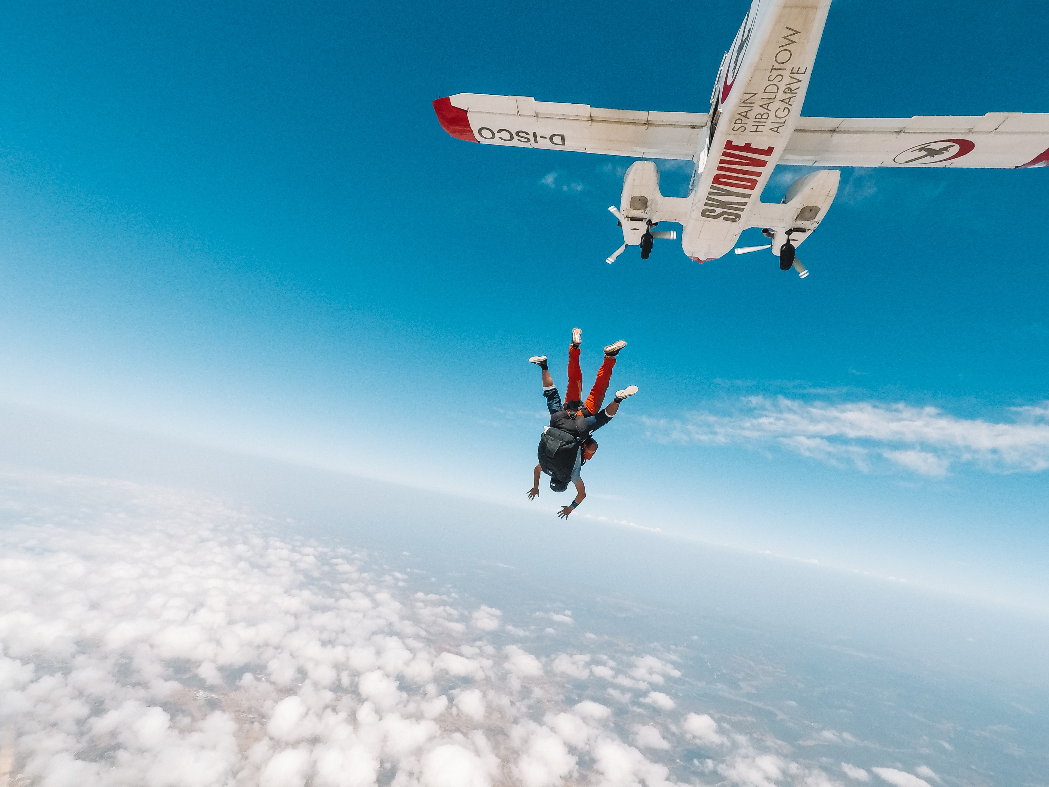 Pair of skydivers jumping from plane