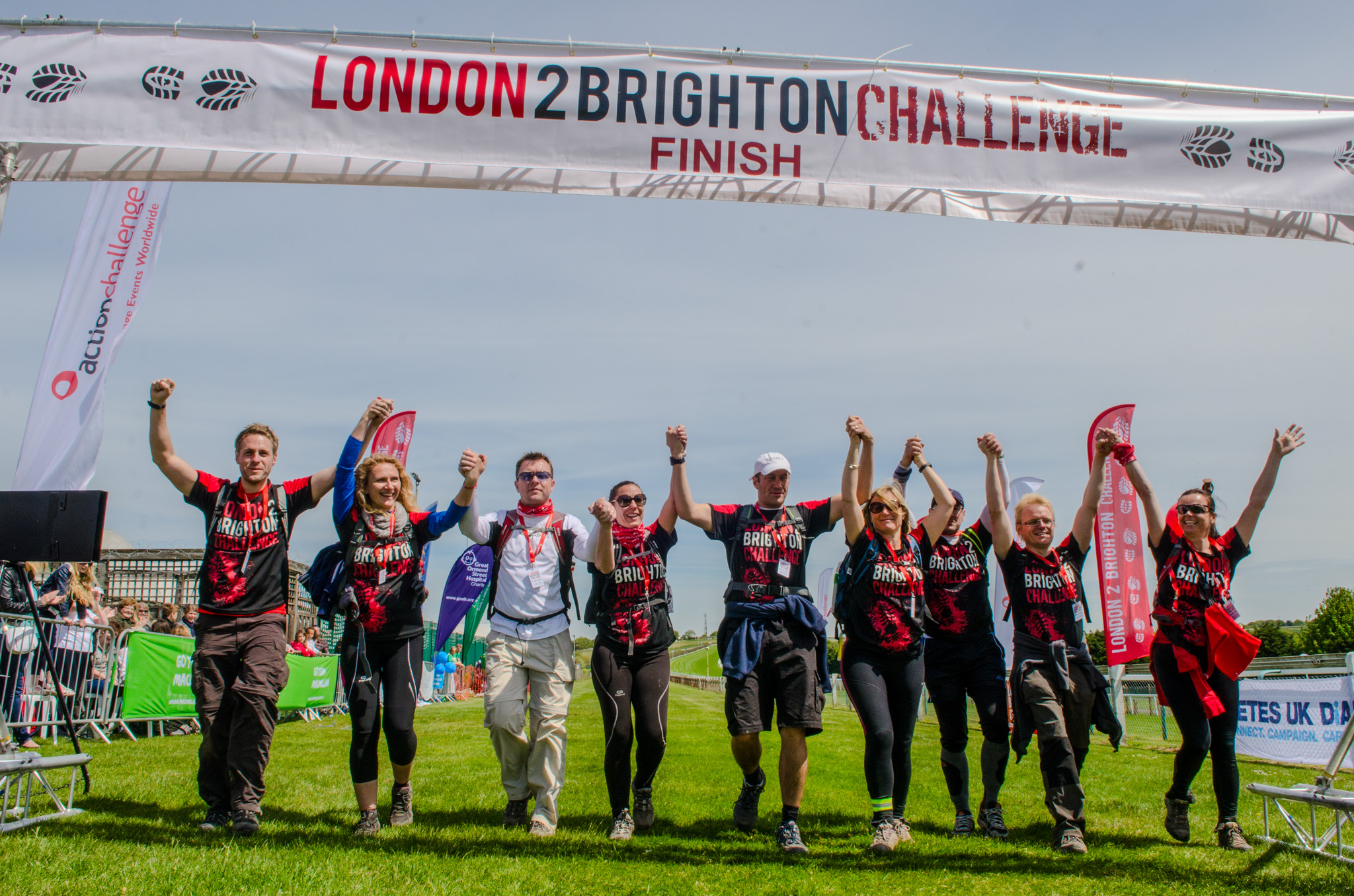 London 2 Brighton Ultra Challenge 2026, photo of participants crossing the finish line in a row, all holding hands