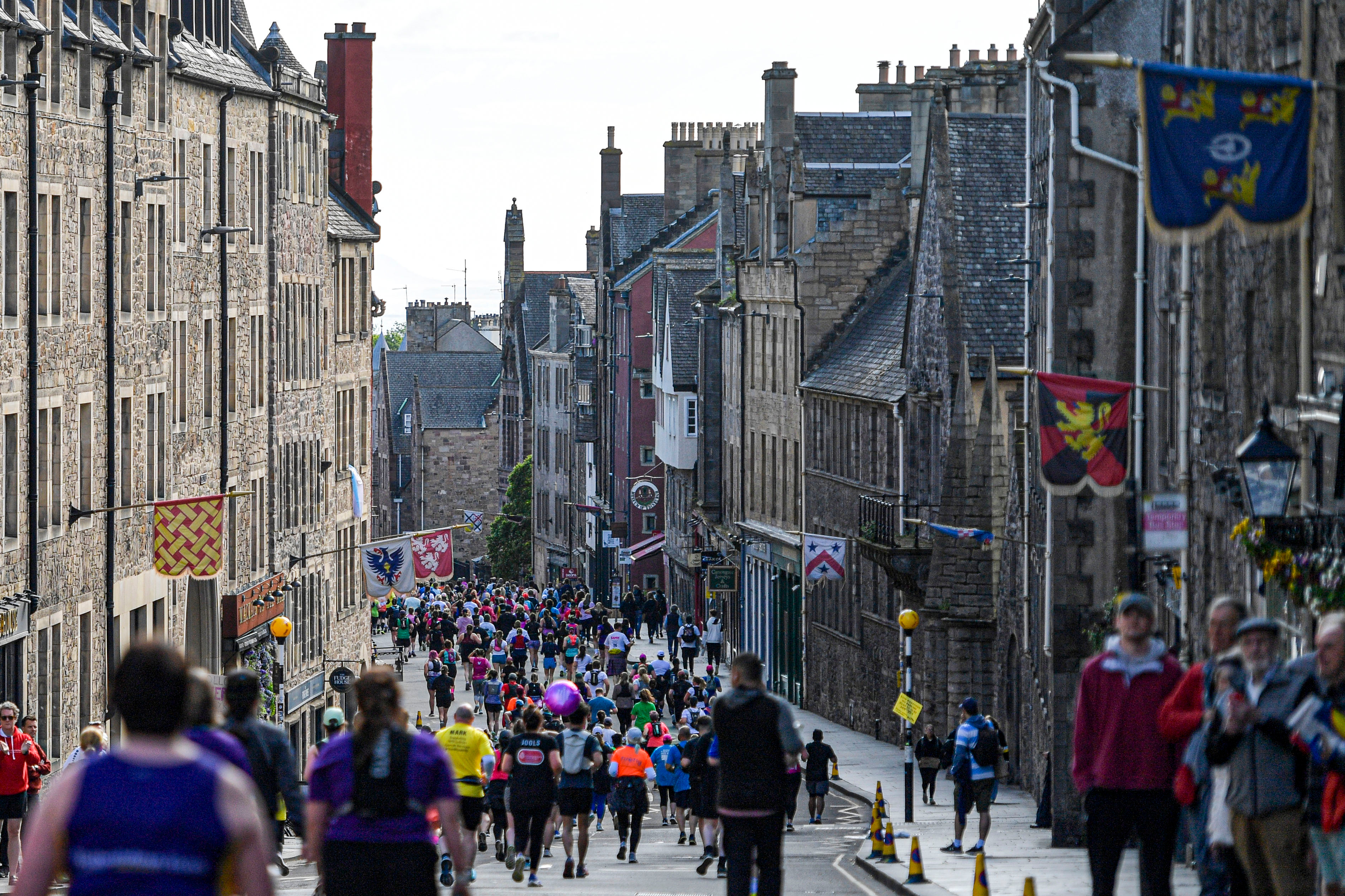 2026 Edinburgh Marathon Festival, photo of event participants running along the route down the Royal Mile