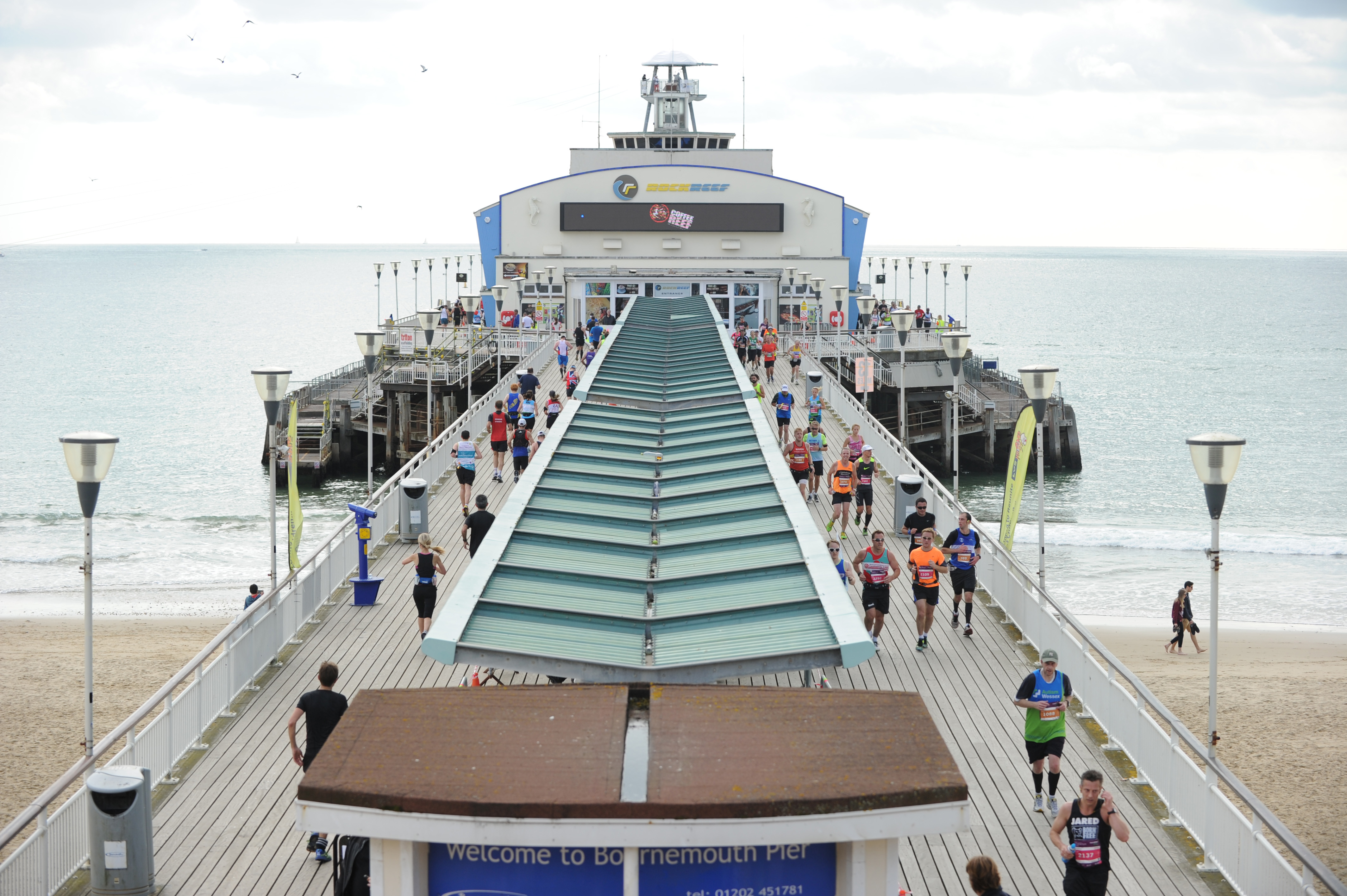 2026 Run Bournemouth Weekend, photo of Bournemouth Pier with event participants running up one sign and down the other along the route