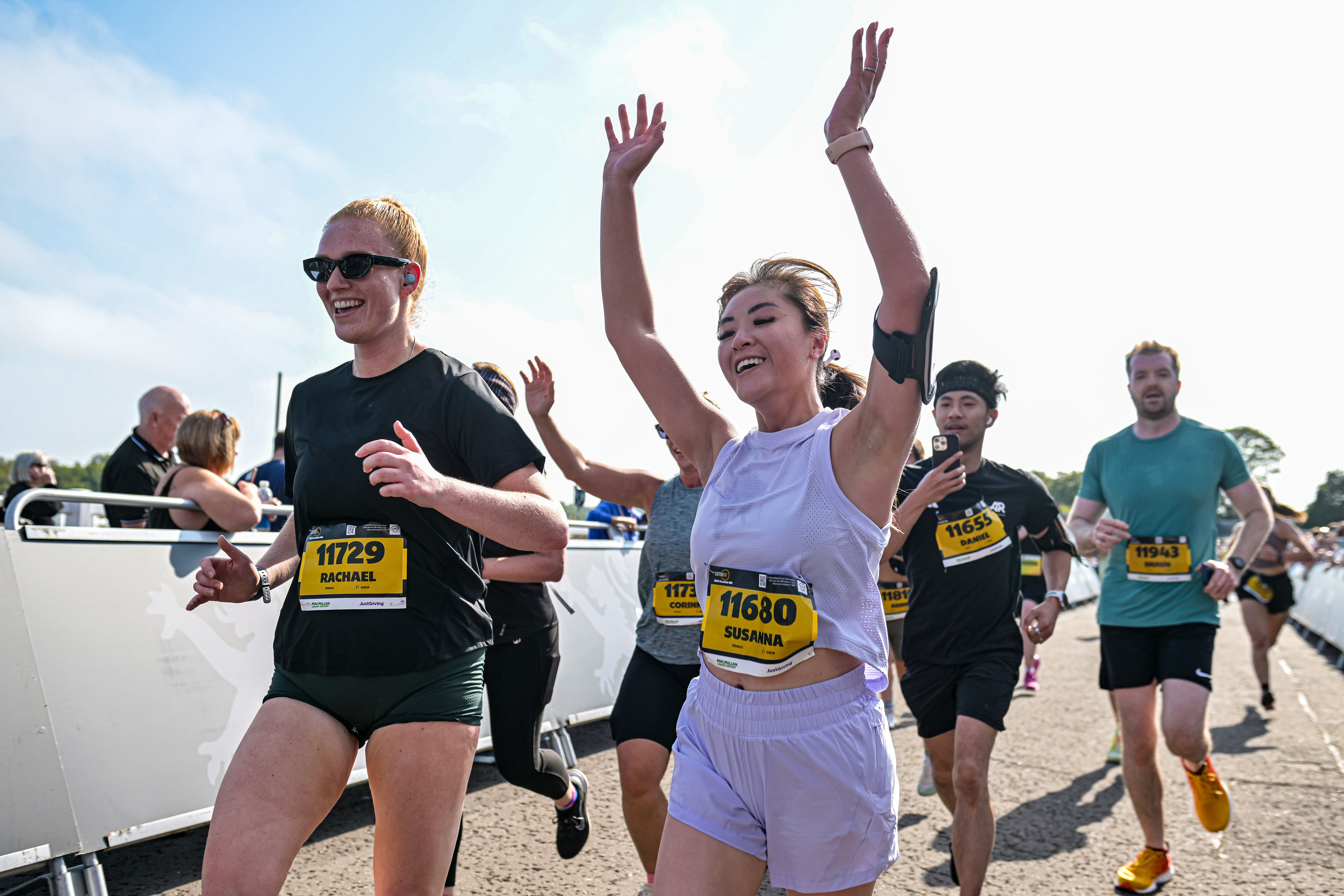 2026 Scottish 10K, photo of event participants running along the event, smiling for the camera
